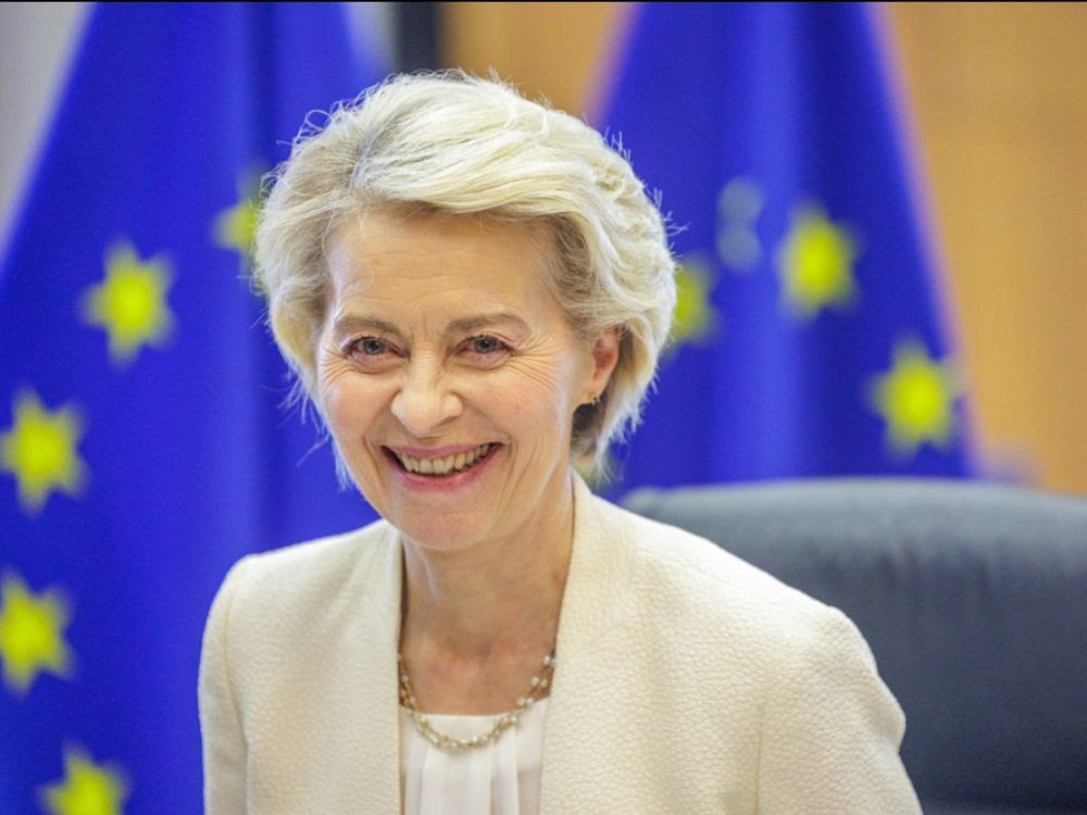 Ursula von der Leyen and EU flag
