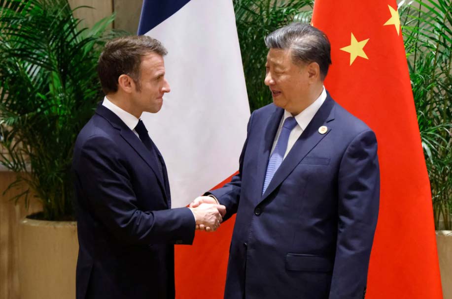 Macron and Xi Jinping handshake