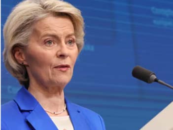 Ursula von der Leyen speaking at podium