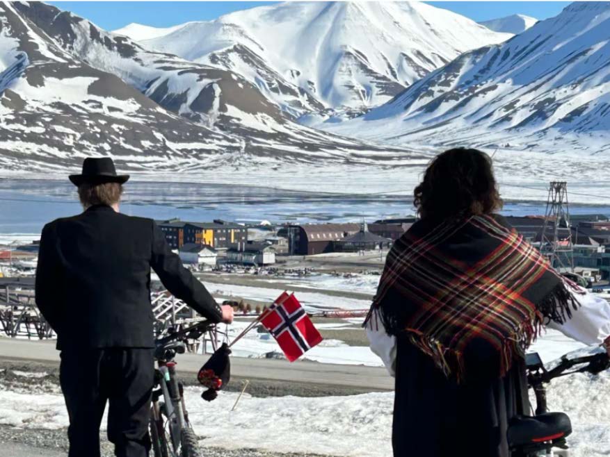 People observing Arctic landscape
