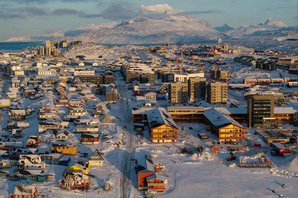 Aerial view of a Greenland town covered in snow