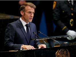 Emmanuel Macron speaking at a podium